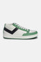 #1 Mid sneaker side view in white and green – recycled PU upper with black chevron and mid‑top collar.