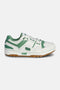 M-100 Low sneaker side view in white and green – full‑grain leather upper with mesh air vent insert, green overlays, PONY chevron and chunky rubber sole.